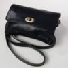 A black crossbody handbag