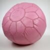 a pink Moroccan leather pouf