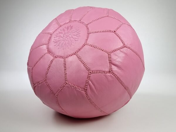 a pink Moroccan leather pouf