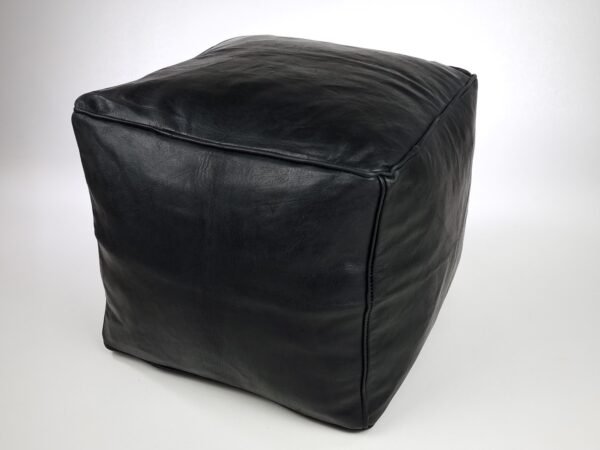 a black square leather ottoman